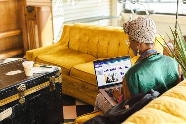 An individual working on their laptop